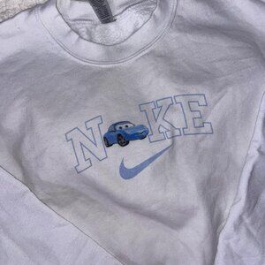 white gildan pullover with Sally Nike logo💙💙 size S but is a bit tight
